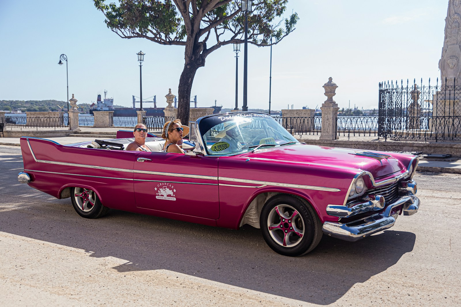 people riding on purple coupe with auto insurance state minimums